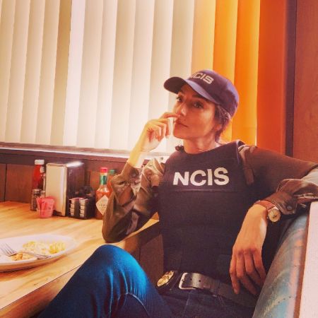 Zadegan's character posing for the photo.